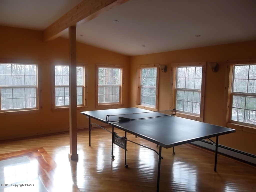 102 Rock Road Dingmans Ferry, PA 18328 - Photo 8 of 13 a view of a dining room with furniture and wooden floor
