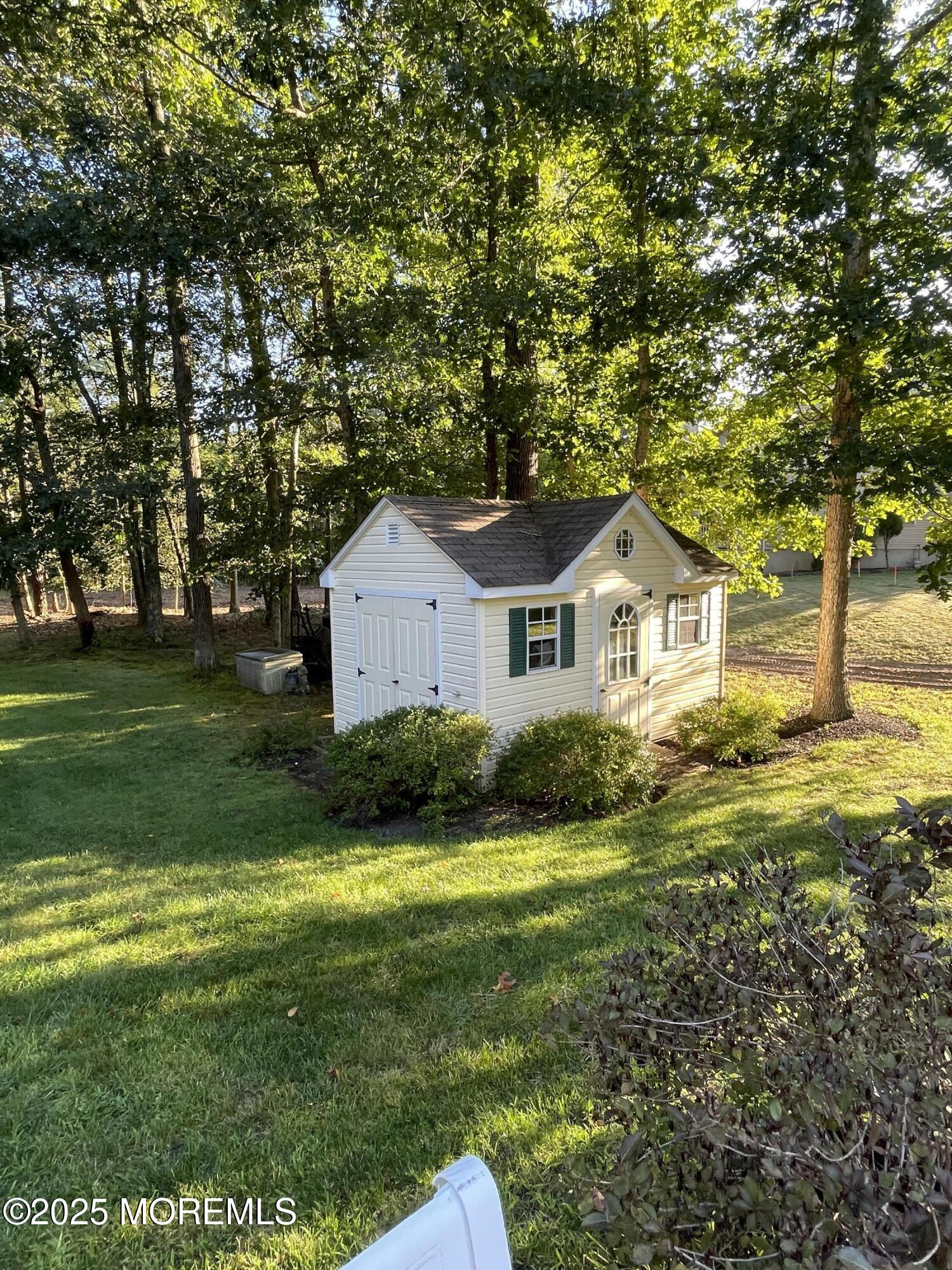 1 Prince Court Jackson, NJ 08527 - Photo 3 of 6 a front view of a house with garden