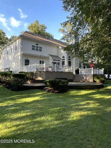 a front view of house with yard and outdoor seating