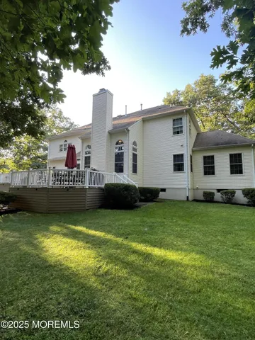 a view of a house with a backyard