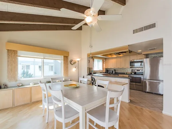 a kitchen with stainless steel appliances kitchen island granite countertop a sink and cabinets