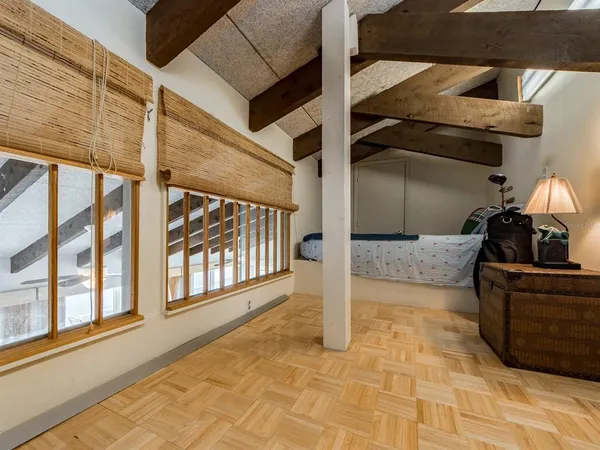 a living room with a couch and a rug