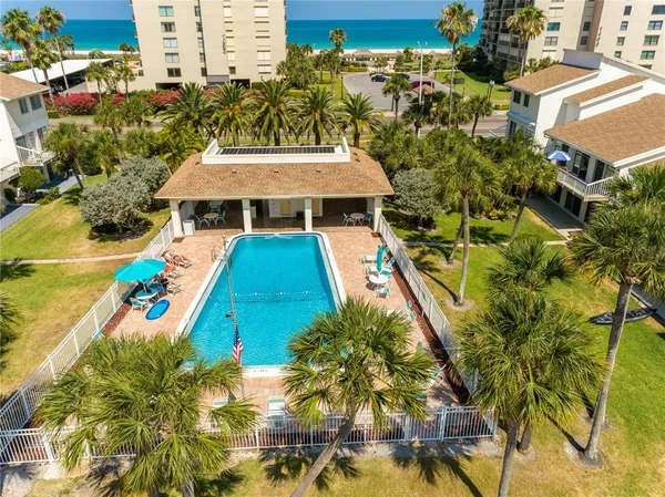 a view of a swimming pool with a patio