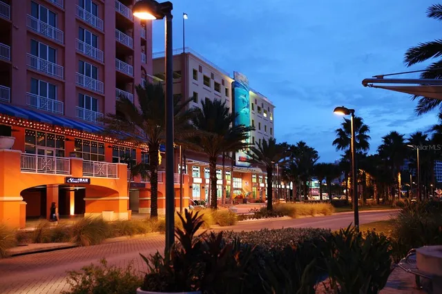 a view of a palm trees front of a house
