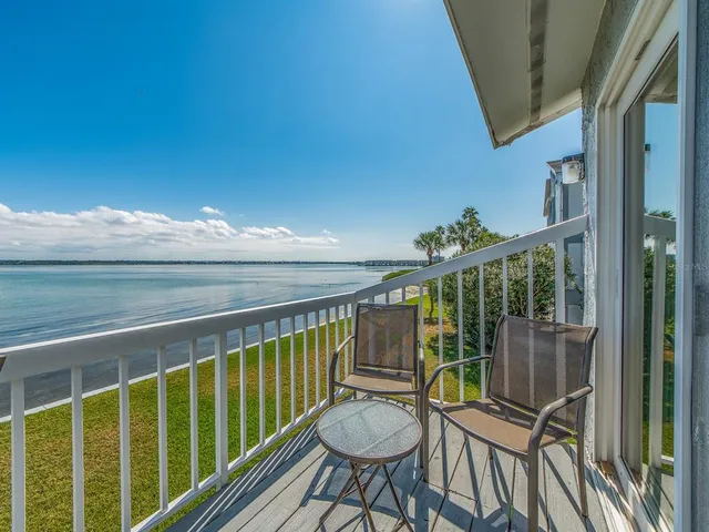 a view of balcony with furniture