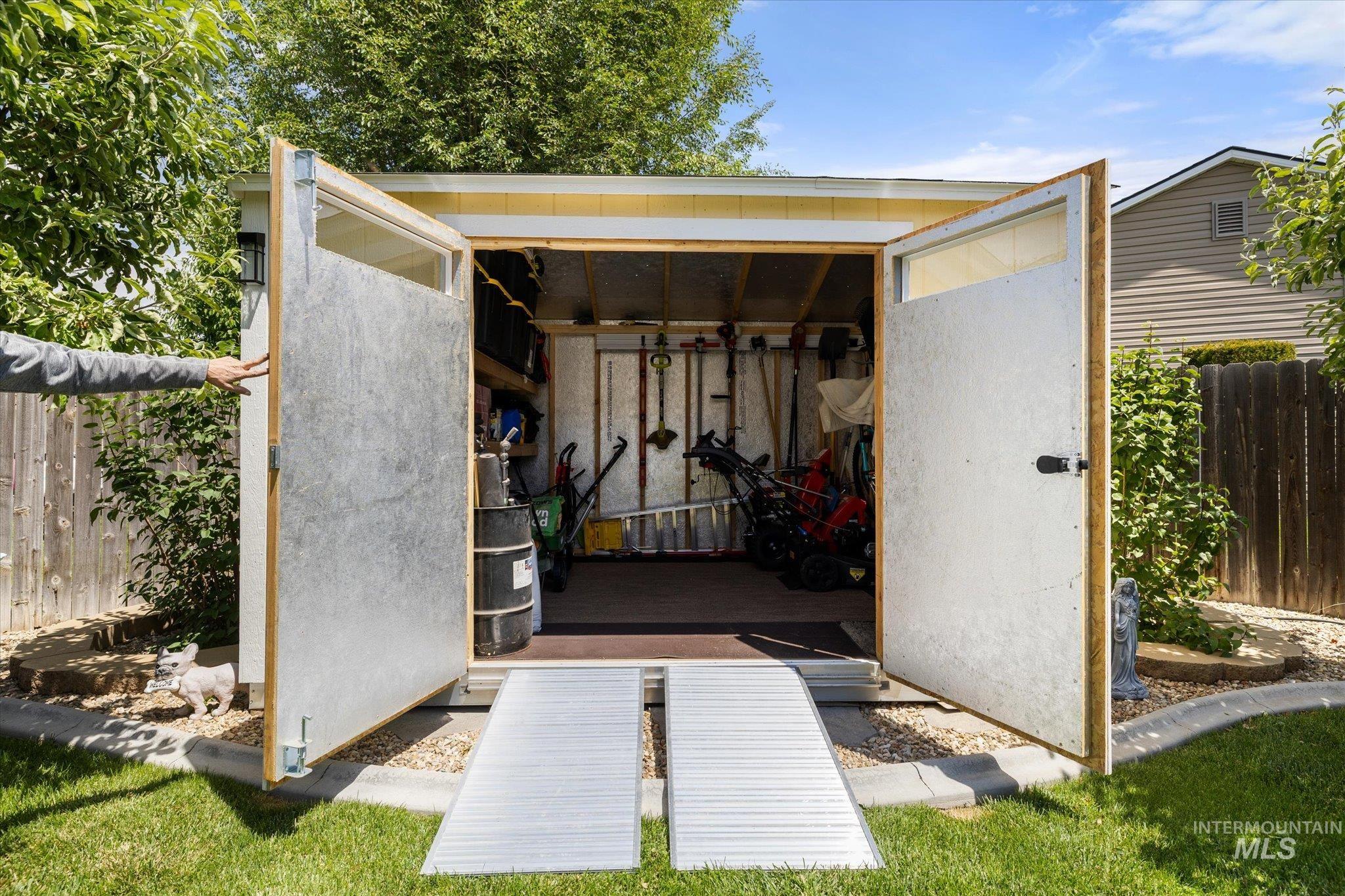5401 Barkley Way Caldwell, ID 83607 - Photo 25 of 35 Outdoor storage shed with double doors and dual aluminum ramps