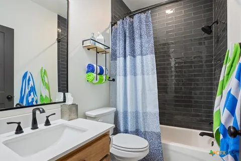 a bathroom with a sink toilet and bathtub