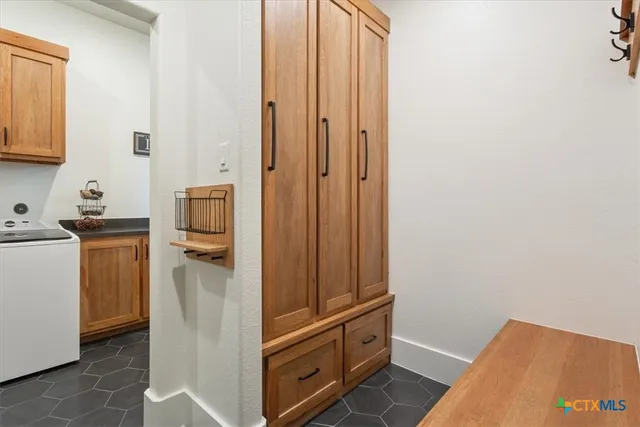 a view of a storage & utility room with a sink