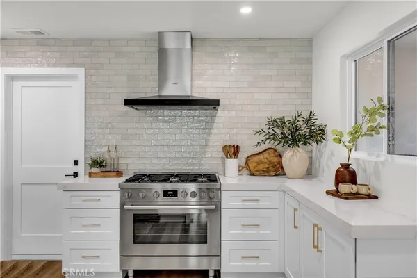 a kitchen with a refrigerator and cabinets
