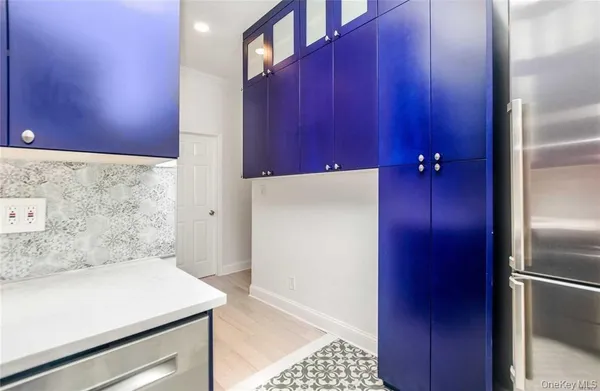 a bathroom with a shower and a sink
