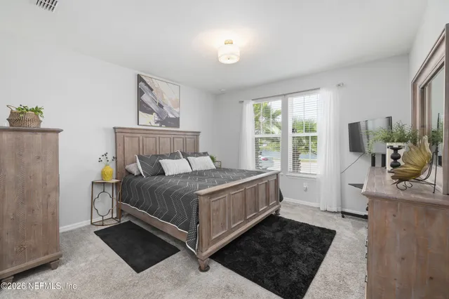 a bathroom with a sink vanity and mirror