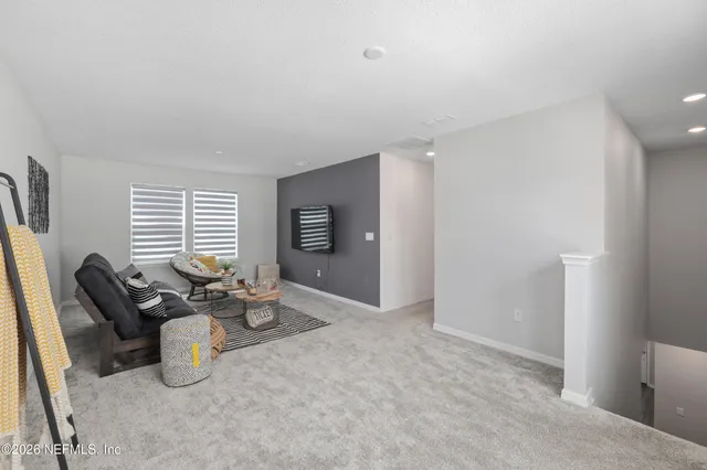 a bedroom with a bed and a desk