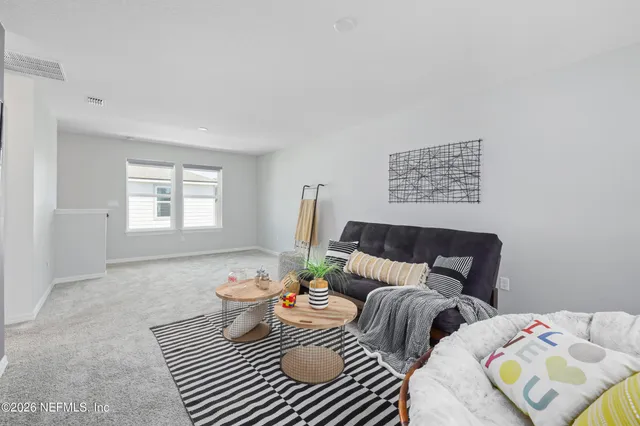 a balcony with furniture and garden view