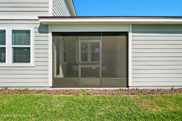 an aerial view of a house with a ocean view