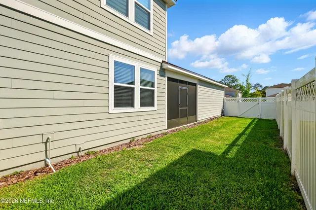 a view of swimming pool with sitting area