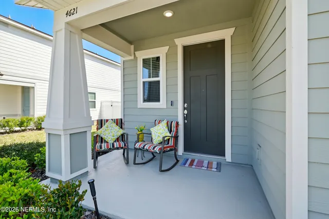 a view of hallway with wooden floor