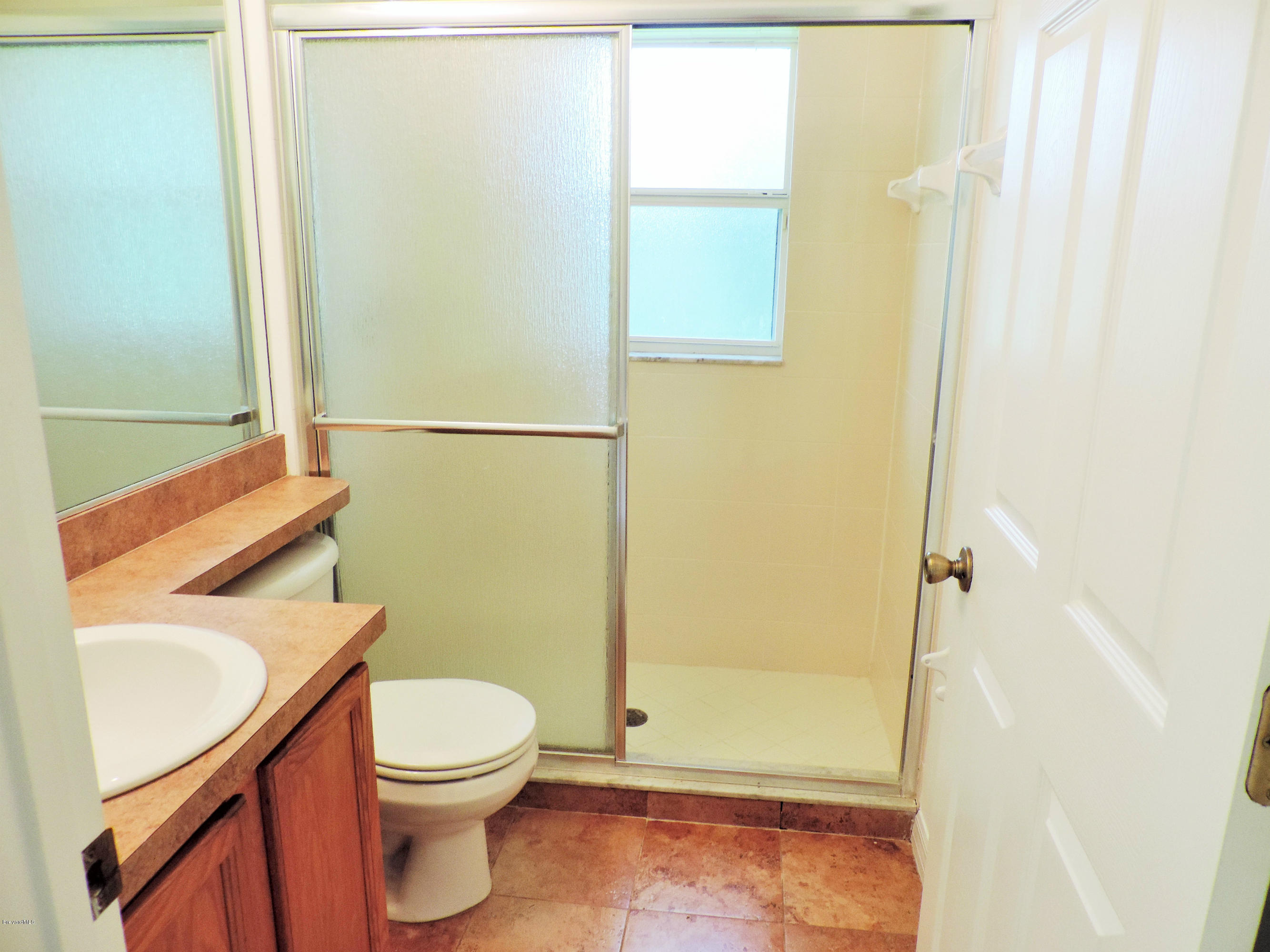 1031 Meadowbrook Road Northeast Palm Bay, FL 32905 - Photo 32 of 41 guest bath