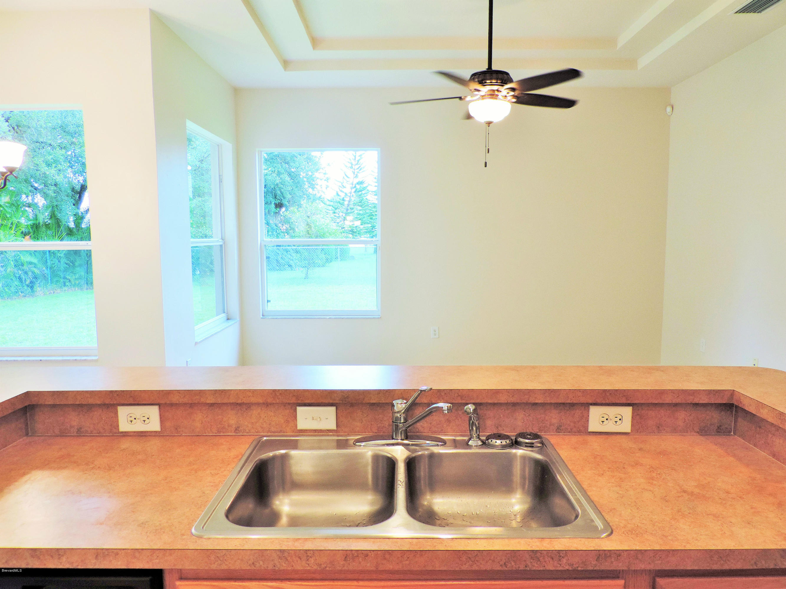 1031 Meadowbrook Road Northeast Palm Bay, FL 32905 - Photo 10 of 41 looking out from kitchen sink