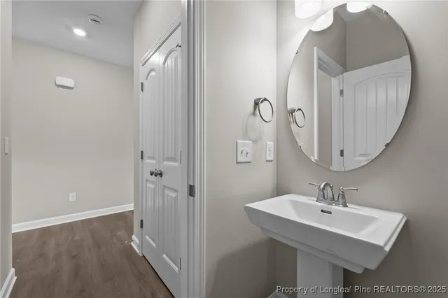 a bathroom with a sink a mirror and a shower