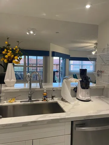 a kitchen with a sink and cabinet