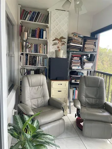a bathroom with a shower a toilet and a sink