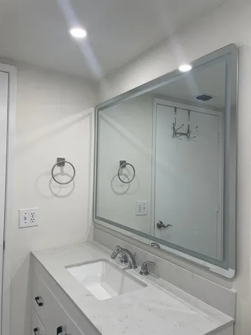 a bathroom with a tub and shower