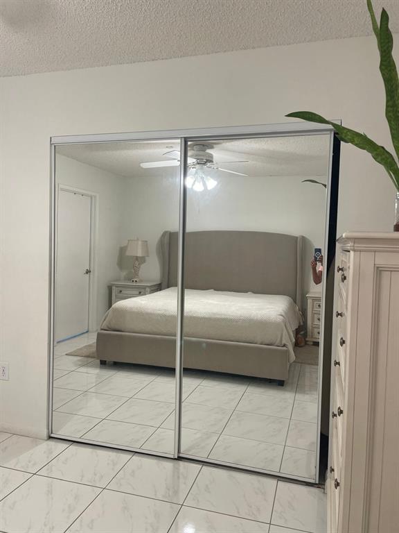 701 Southwest 142nd Avenue, Unit 411S Pembroke Pines, FL 33027 - Photo 8 of 9 a bathroom with a tub and shower