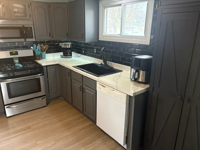 a kitchen with a stove and a sink