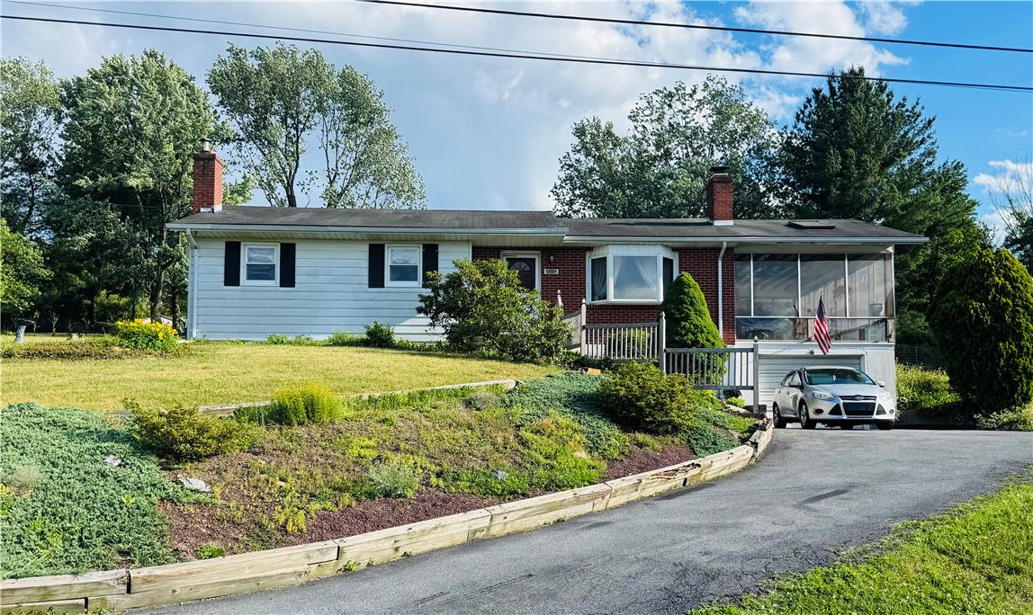 5054 Mill Road Schnecksville, PA 18078 - Photo 2 of 29 a front view of a house with garden