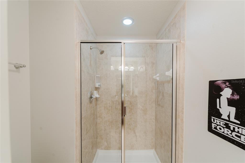 8961 Majesty Palm Road Kissimmee, FL 34747 - Photo 29 of 40 a bathroom with a shower
