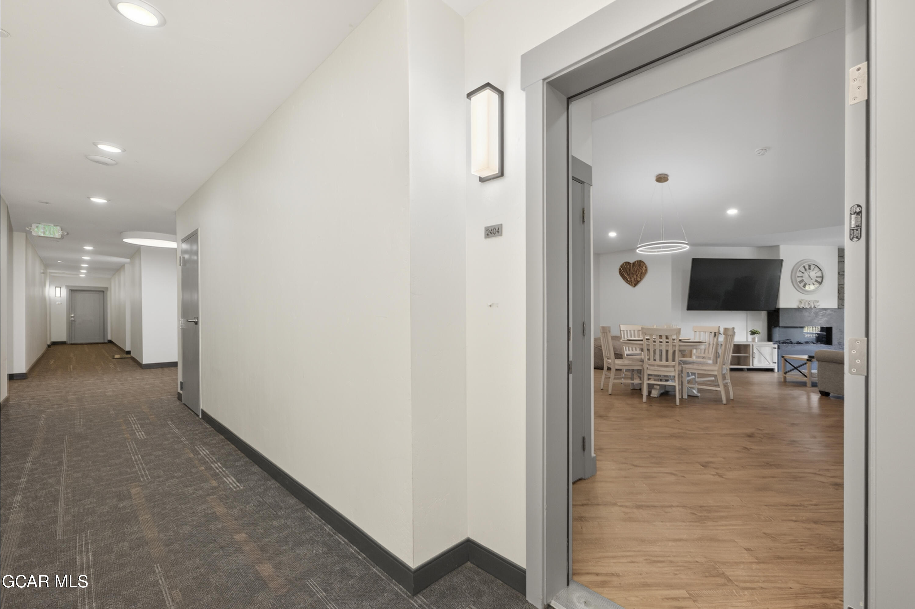 a view of kitchen with furniture and a refrigerator