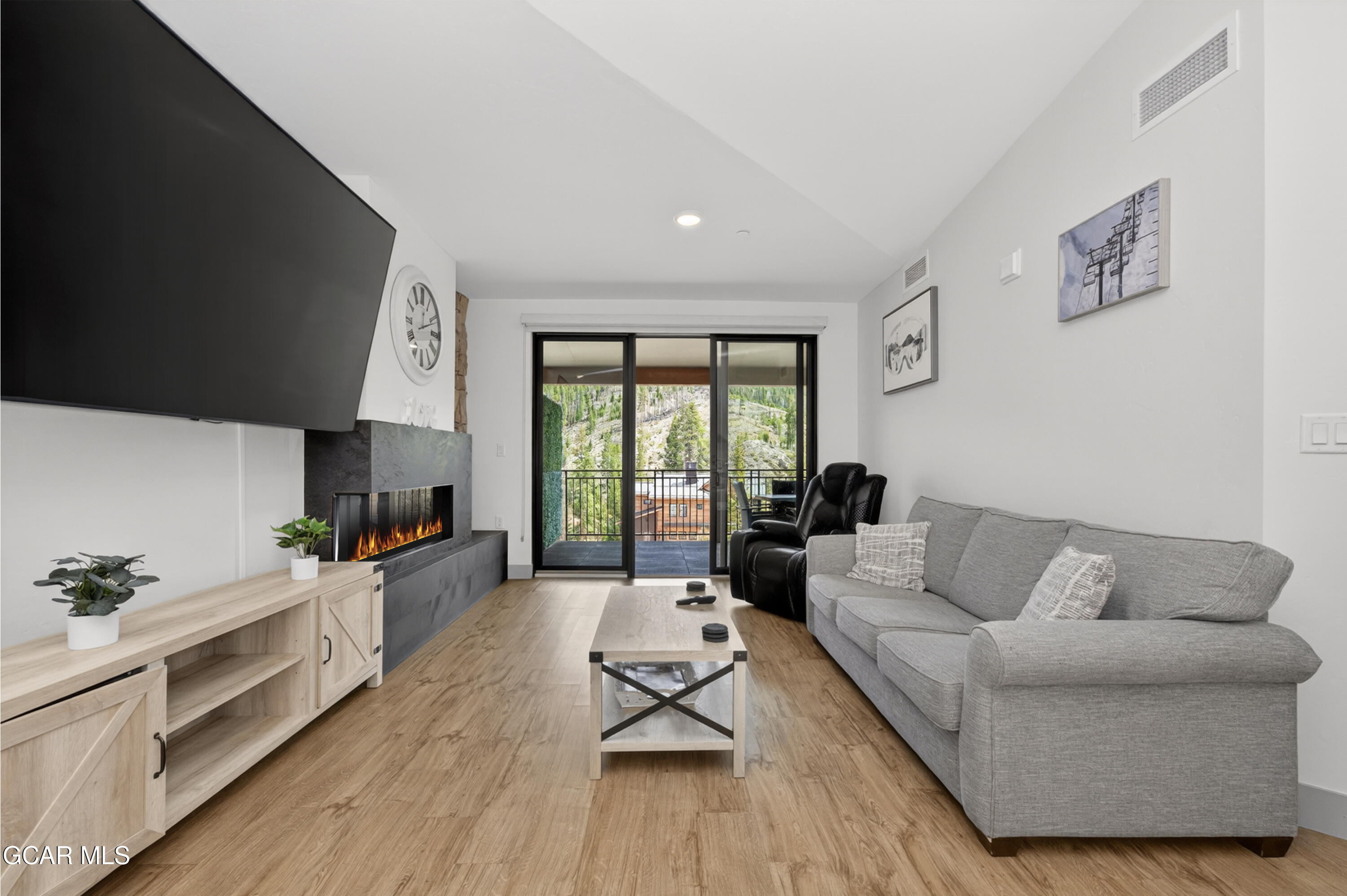 144 Ski Idlewild Road, Unit 2404 Winter Park, CO 80482 - Photo 11 of 43 a living room with furniture and a large window