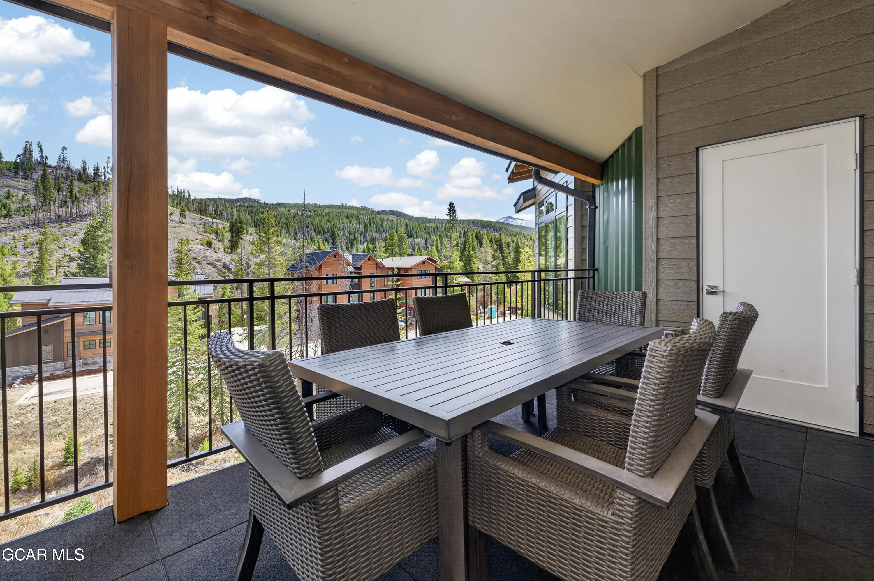 144 Ski Idlewild Road, Unit 2404 Winter Park, CO 80482 - Photo 13 of 43 a view of a city from a dining room with furniture and window