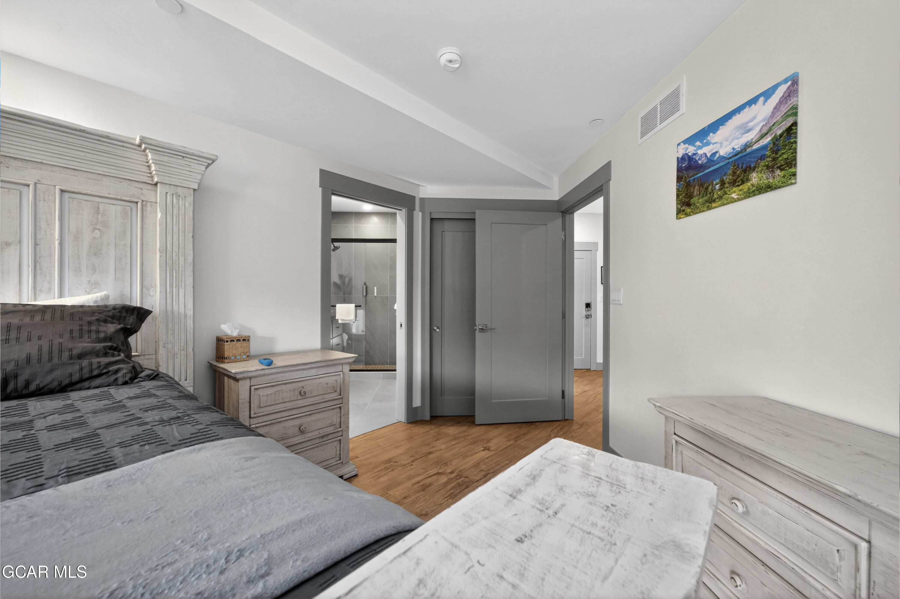 144 Ski Idlewild Road, Unit 2404 Winter Park, CO 80482 - Photo 18 of 43 a bedroom with a bed and a dresser