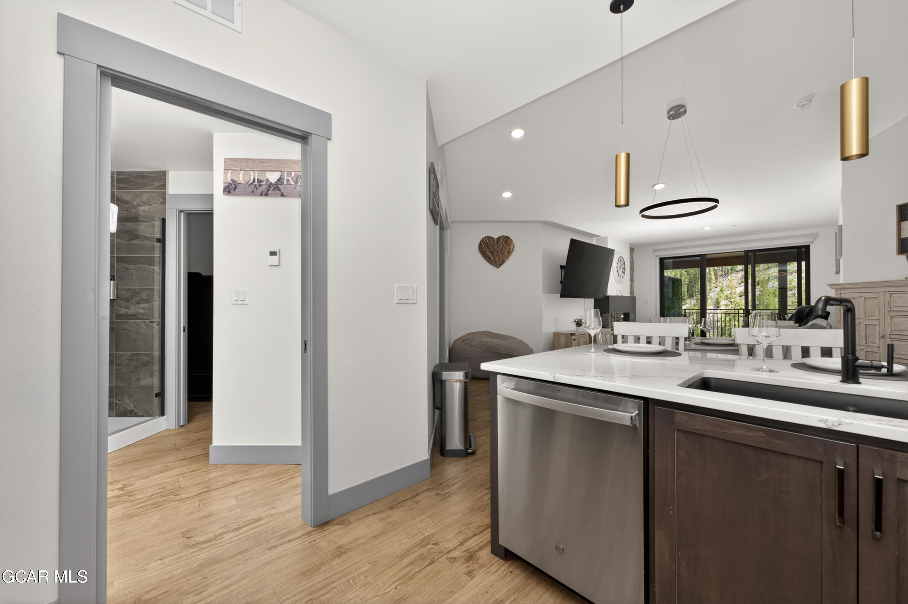 144 Ski Idlewild Road, Unit 2404 Winter Park, CO 80482 - Photo 21 of 43 a kitchen with a sink and a refrigerator