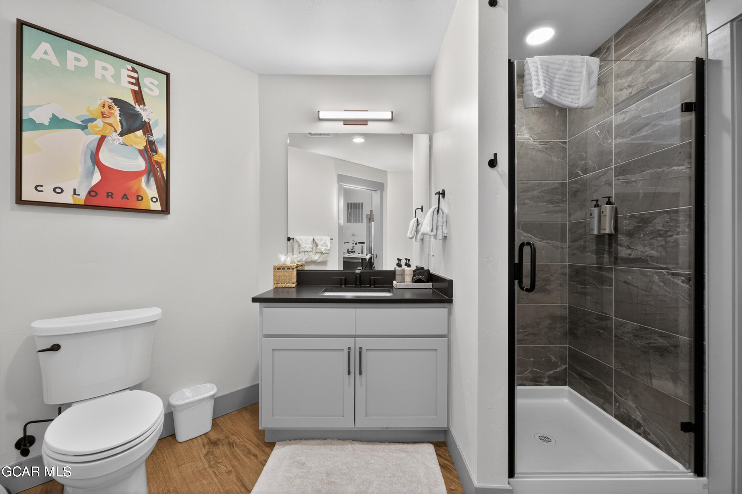 144 Ski Idlewild Road, Unit 2404 Winter Park, CO 80482 - Photo 22 of 43 a bathroom with a sink a toilet and shower