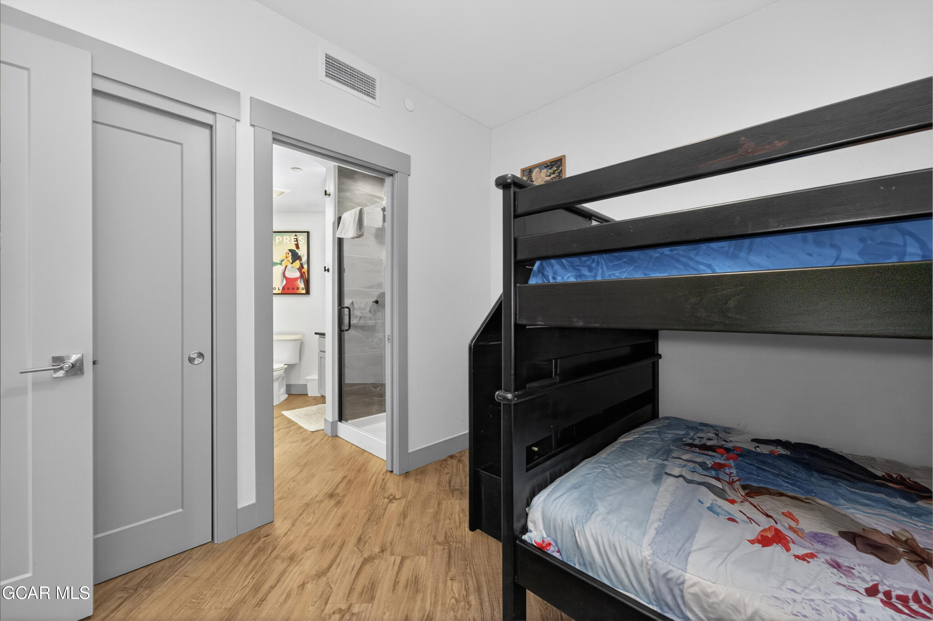 144 Ski Idlewild Road, Unit 2404 Winter Park, CO 80482 - Photo 23 of 43 a bedroom with a bed and a dresser