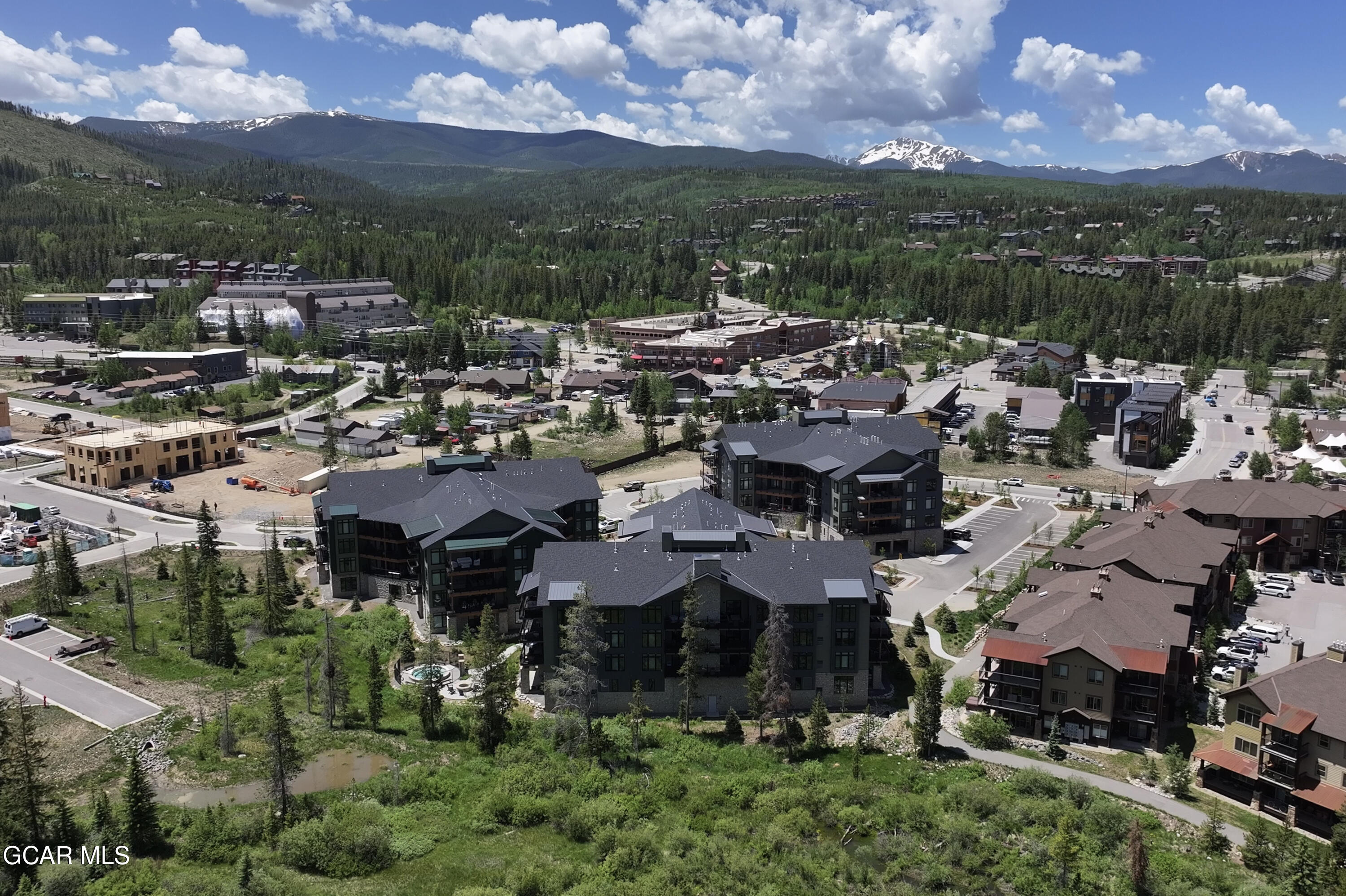 144 Ski Idlewild Road, Unit 2404 Winter Park, CO 80482 - Photo 31 of 43 a view of a city with lots of residential buildings ocean and mountain view in back