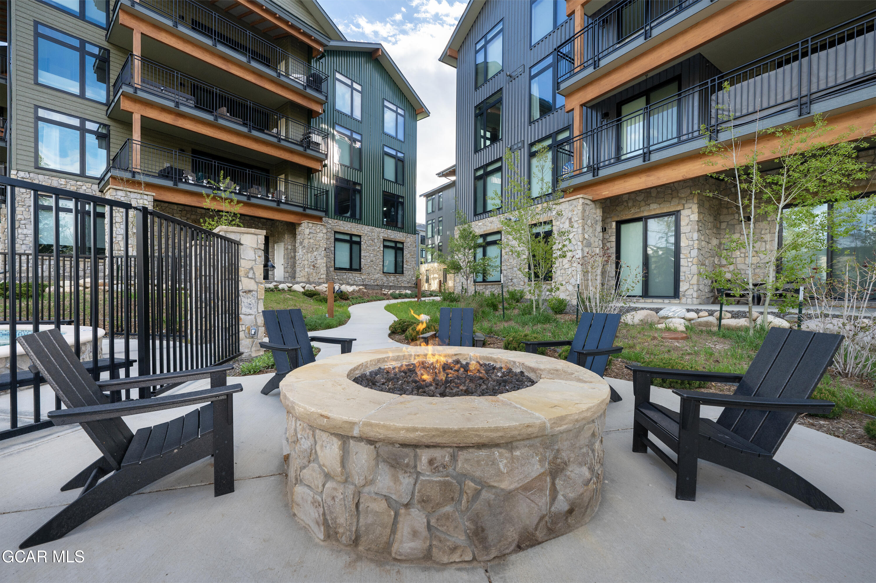 144 Ski Idlewild Road, Unit 2404 Winter Park, CO 80482 - Photo 36 of 43 a view of a patio with a table and chairs