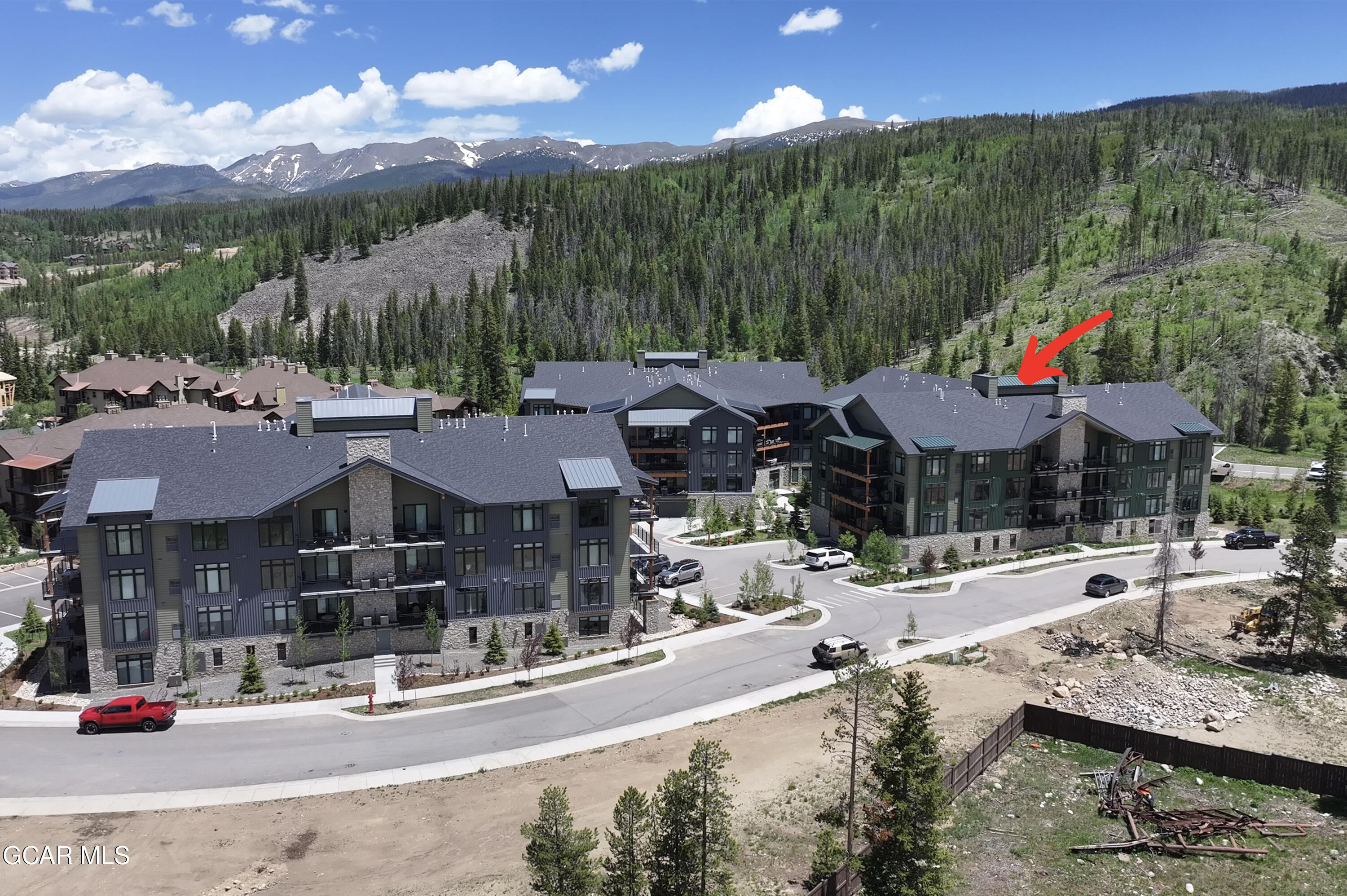 144 Ski Idlewild Road, Unit 2404 Winter Park, CO 80482 - Photo 37 of 43 a front view of a house with a yard and lake view