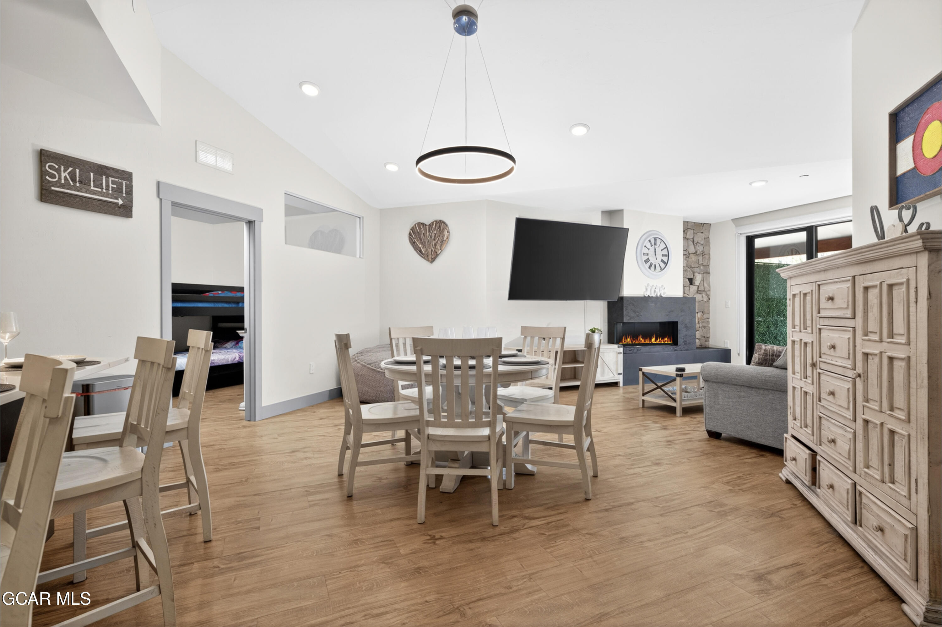 144 Ski Idlewild Road, Unit 2404 Winter Park, CO 80482 - Photo 4 of 43 a view of a livingroom with furniture and a flat screen tv