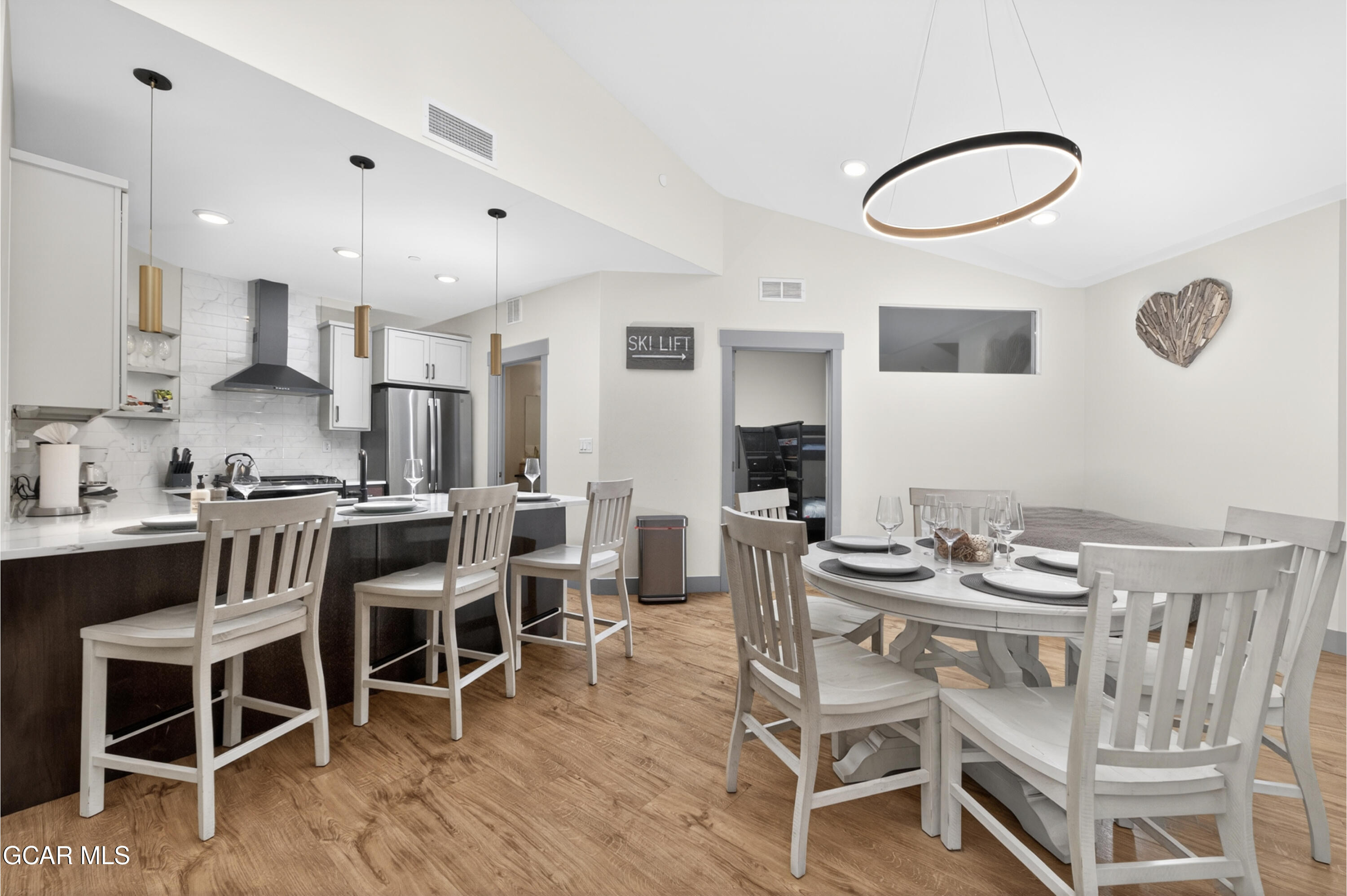 144 Ski Idlewild Road, Unit 2404 Winter Park, CO 80482 - Photo 5 of 43 a dining room with furniture and wooden floor