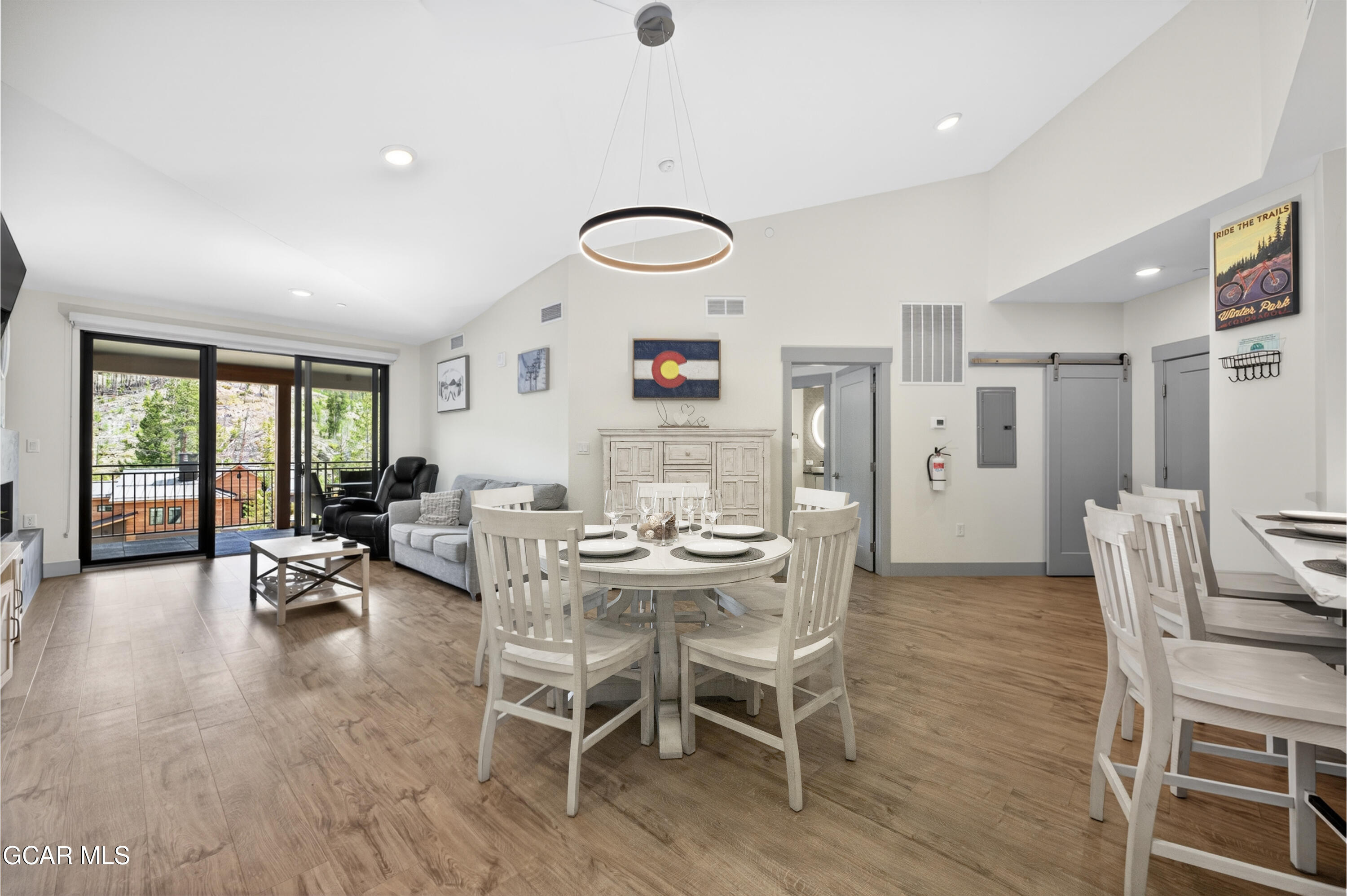 144 Ski Idlewild Road, Unit 2404 Winter Park, CO 80482 - Photo 6 of 43 a view of a dining room with furniture and a large window