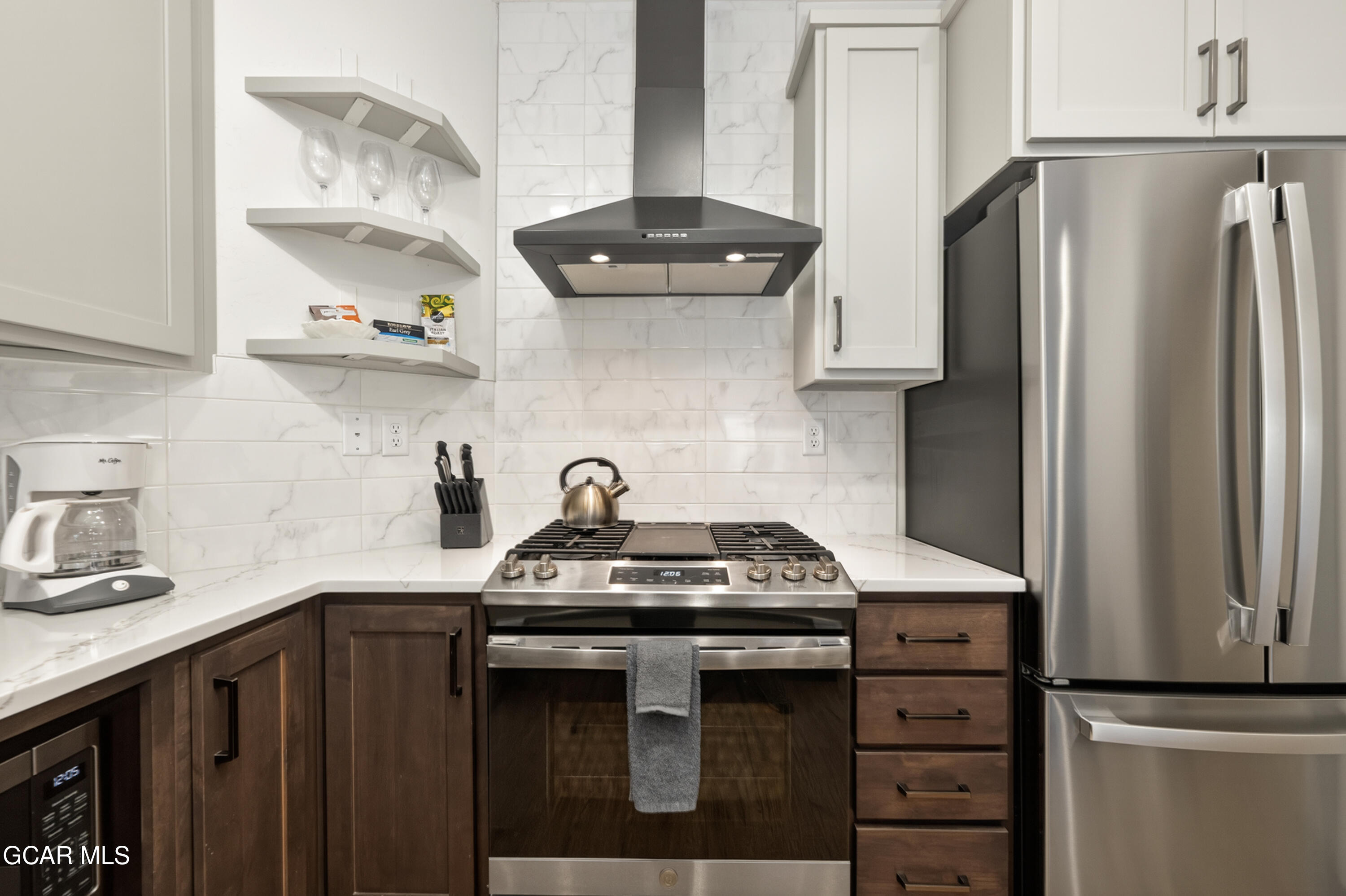144 Ski Idlewild Road, Unit 2404 Winter Park, CO 80482 - Photo 8 of 43 a kitchen with stainless steel appliances a sink stove and refrigerator