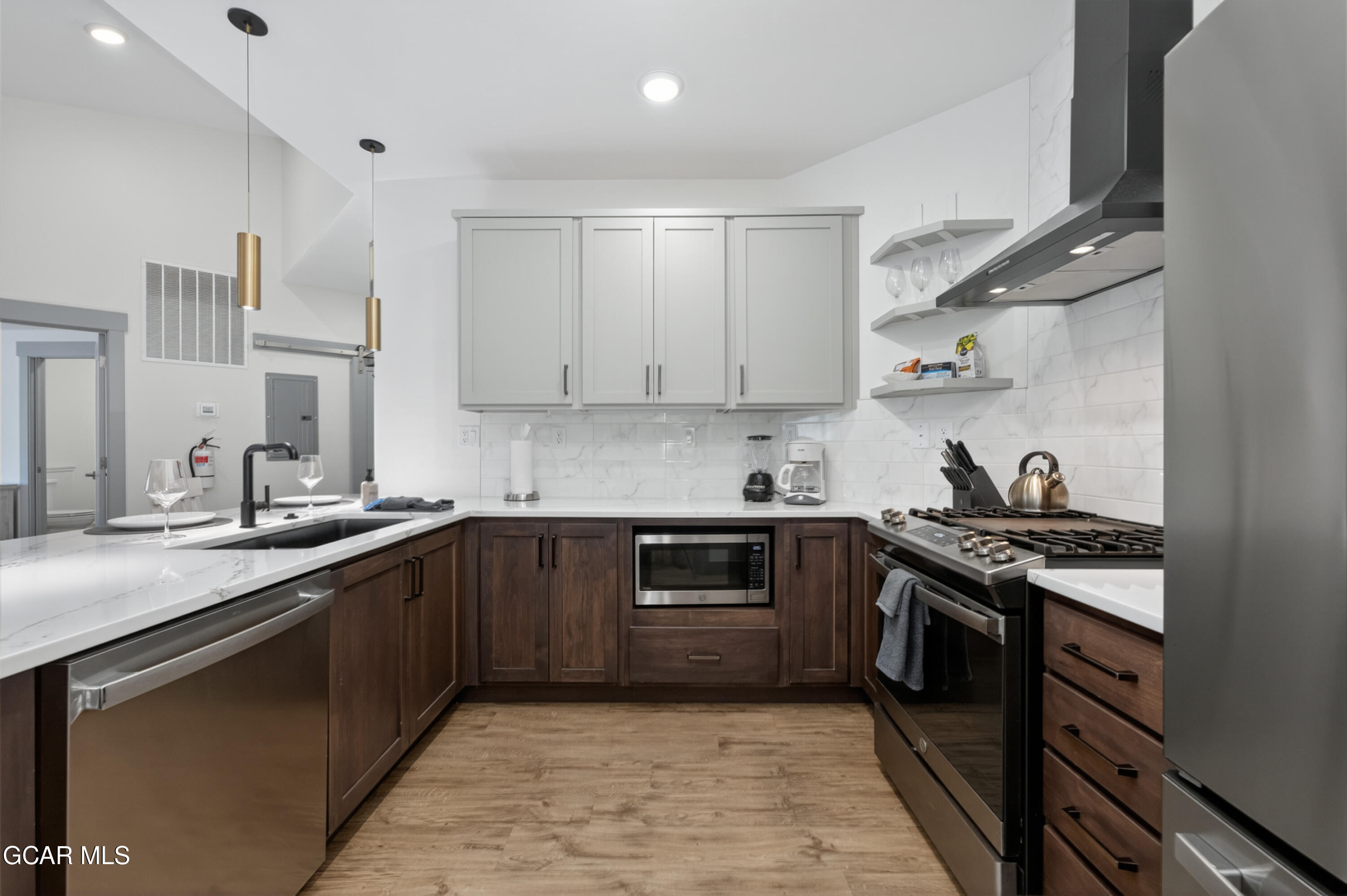 144 Ski Idlewild Road, Unit 2404 Winter Park, CO 80482 - Photo 9 of 43 a kitchen with stainless steel appliances granite countertop a sink stove and cabinets