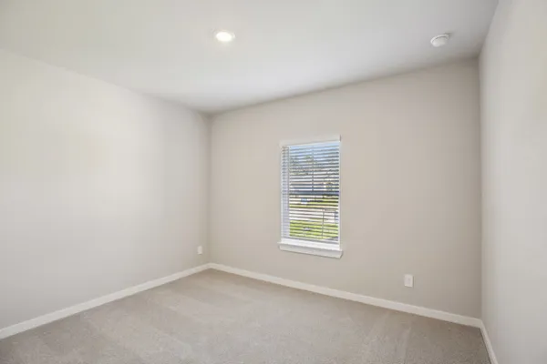 an empty room with closet area