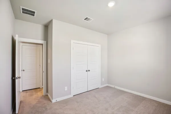 an empty room with a empty space and windows