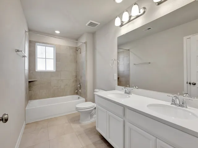 a bathroom with a toilet a sink and a bathtub