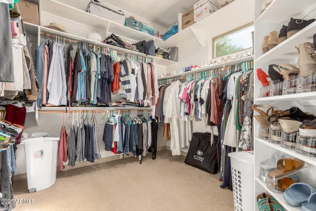 a bedroom with a bed and a potted plant
