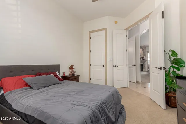 a bathroom with a sink vanity mirror and toilet